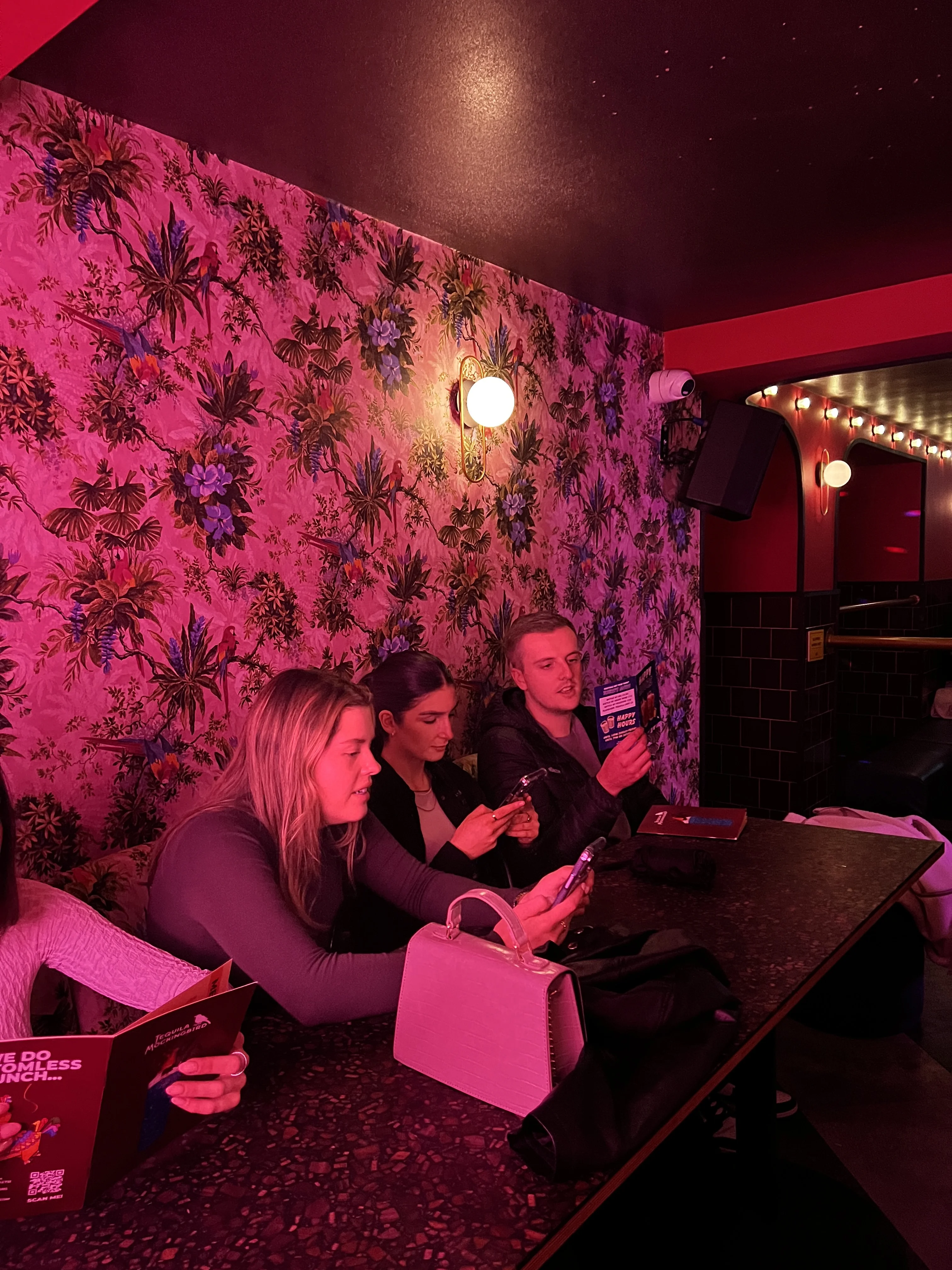 Friends posing at Tequila Mockingbird